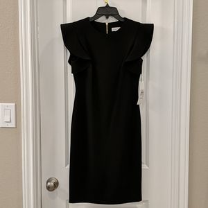 Black ruffle sleeve dress with gold zipper detail